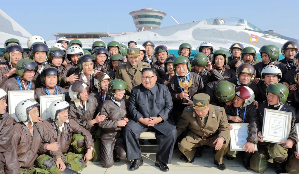 A photo released on Saturday shows North Korean leader Kim Jong-un (centre) posing for a photo during Combat Flight Contest-2019 at Wonsan Kalma Airport in North Korea. Photo: KCNA via EPA-EFE A photo released on Saturday shows North Korean leader Kim Jong-un (centre) posing for a photo during Combat Flight Contest-2019 at Wonsan Kalma Airport in North Korea. Photo: KCNA via EPA-EFE