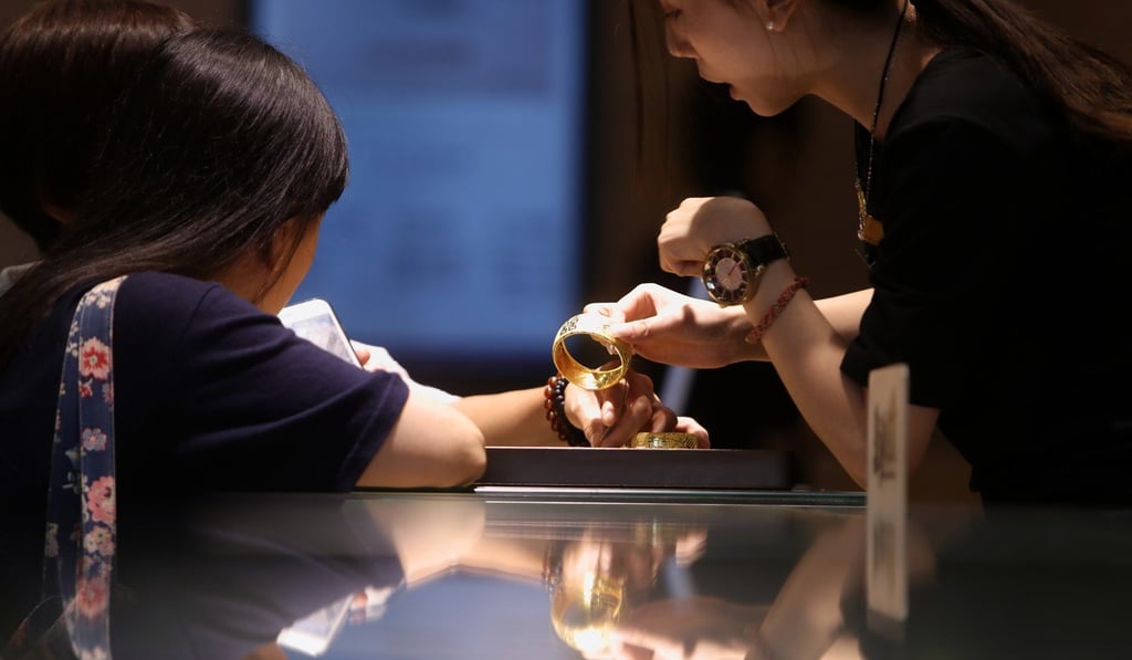 A customer at Tse Sui Luen Jewellery’s Tsim Sha Tsui outlet. Photo: Winson Wong