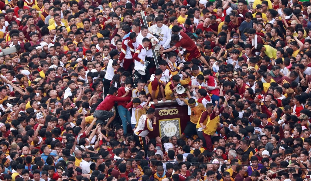 Catholic devotees jostle to touch the statue of the Black Nazarene on its feast day in Manila, Philippines. Photo: Reuters