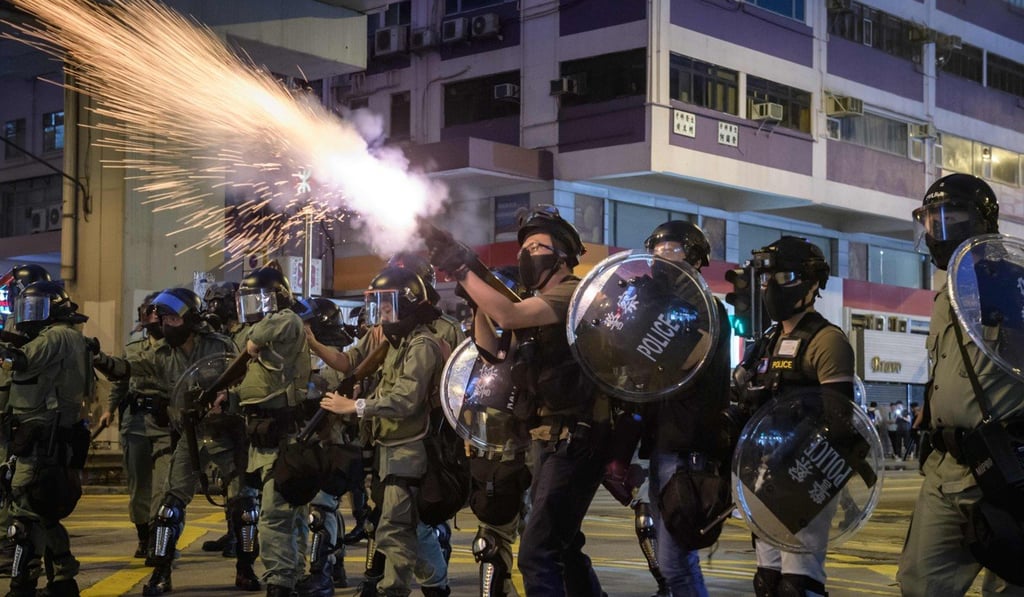 Police fire tear gas to disperse protesters from Nathan Road in Kowloon district in Hong Kong on October 20, 2019. Photo: AFP
