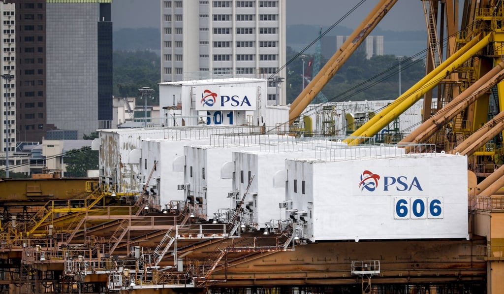 Container cranes bearing the logo of the Port of Singapore Authority are seen in Singapore. Photo: EPA-EFE