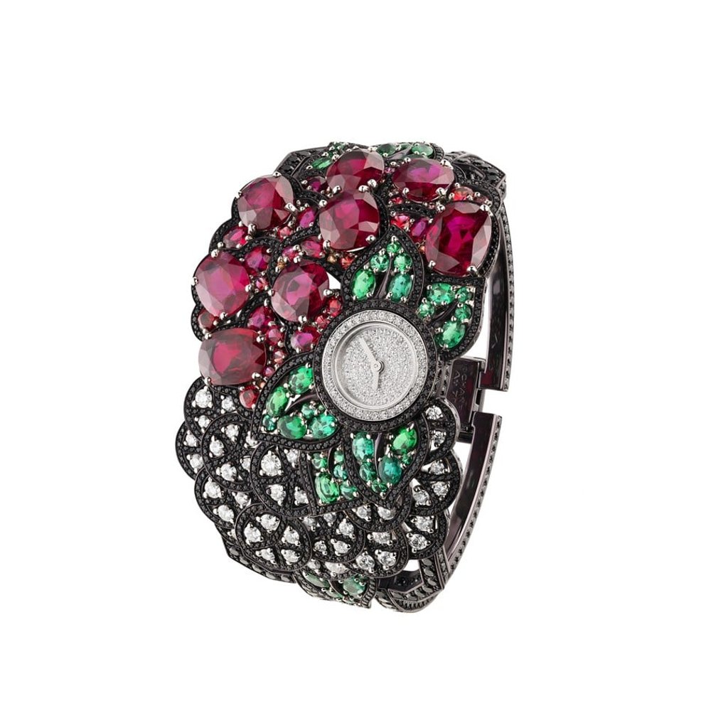 The Calligraphie Florale montre by Chanel has a dial surrounded by a gem garden comprising white gold, platinum, rubies, emeralds, orange sapphires, black spinels and diamonds.