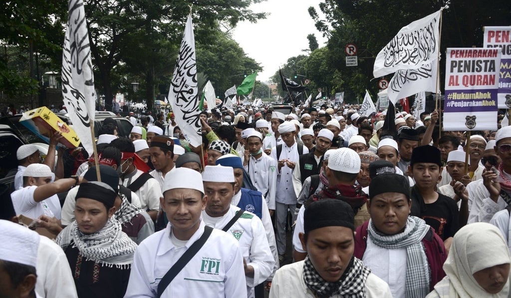 Muslim protesters take to the streets of Jakarta in 2017 against then city governor Ahok. Photo: AFP