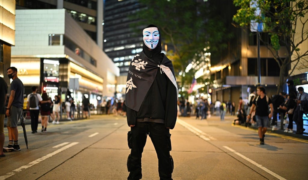 A protester wears a mask while attending a rally in Hong Kong. Photo: AFP A protester wears a mask while attending a rally in Hong Kong. Photo: AFP