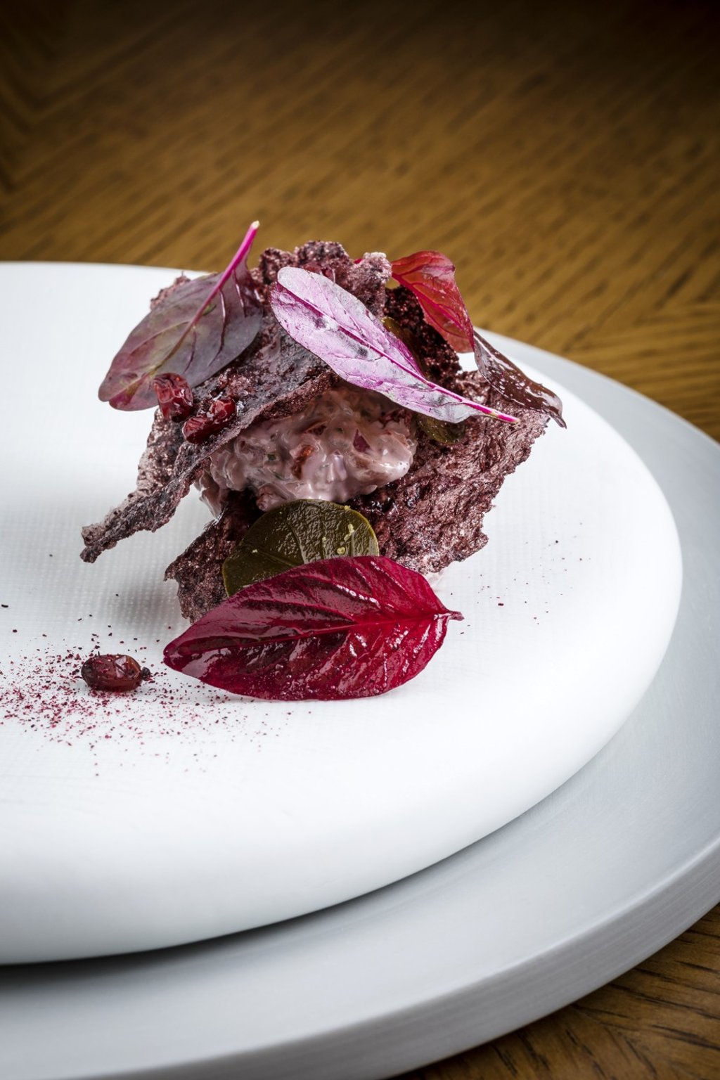 A colourful presentation of raw grass-fed beef with dried barberries, caper leaves, Shiraz and hibiscus at Amber, Landmark Mandarin Hong Kong. Photo: Andrew Loiterton A colourful presentation of raw grass-fed beef with dried barberries, caper leaves, Shiraz and hibiscus at Amber, Landmark Mandarin Hong Kong. Photo: Andrew Loiterton