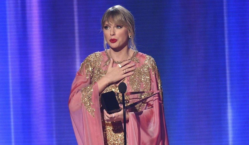 Taylor Swift accepts the award for artist of the year at the American Music Awards in Los Angeles. Photo: AP