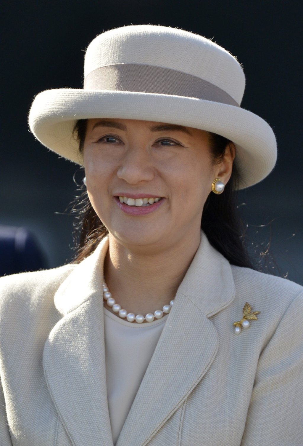 Japan’s then-Crown Princess Masako smiles as she sends off Emperor Akihito and Empress Michiko at Haneda Airport in Tokyo, in 2013. Photo: EPA