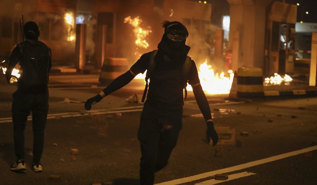 Toll booths on the Hung Hom side of the Cross-Harbour Tunnel were pelted with petrol bombs. Photo: AP