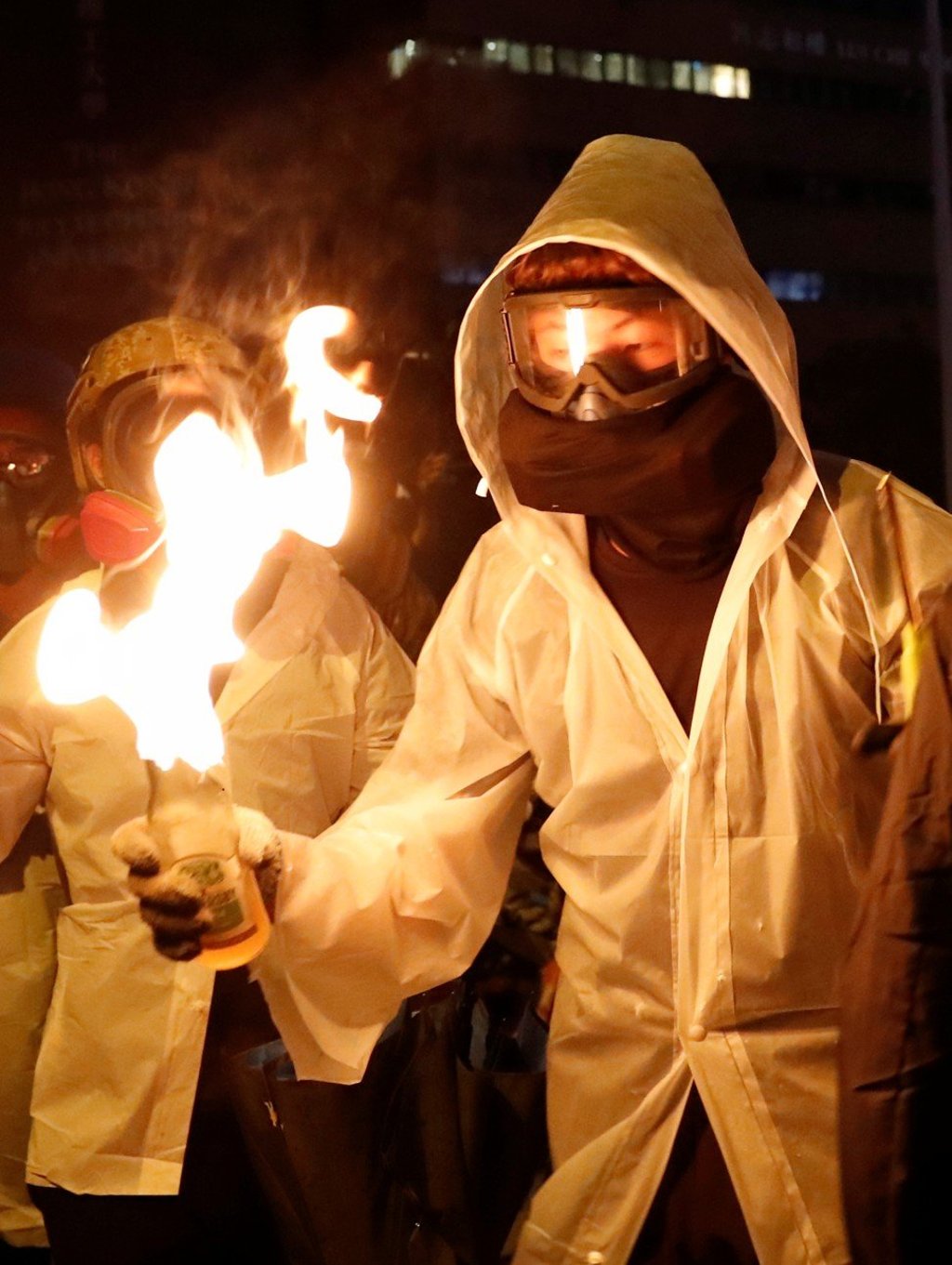 A protester holds a Molotov cocktail during clashes with police outside Hong Kong Polytechnic University, on November 17. Photo: Reuters