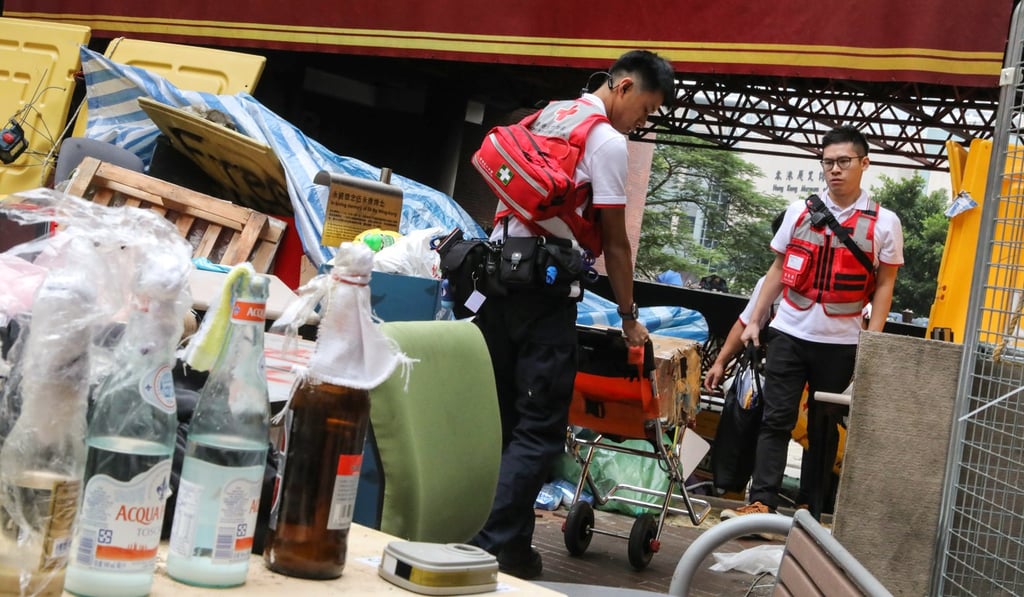 Two members of the Red Cross prepare to enter the Polytechnic University campus. Photo: K.Y. Cheng