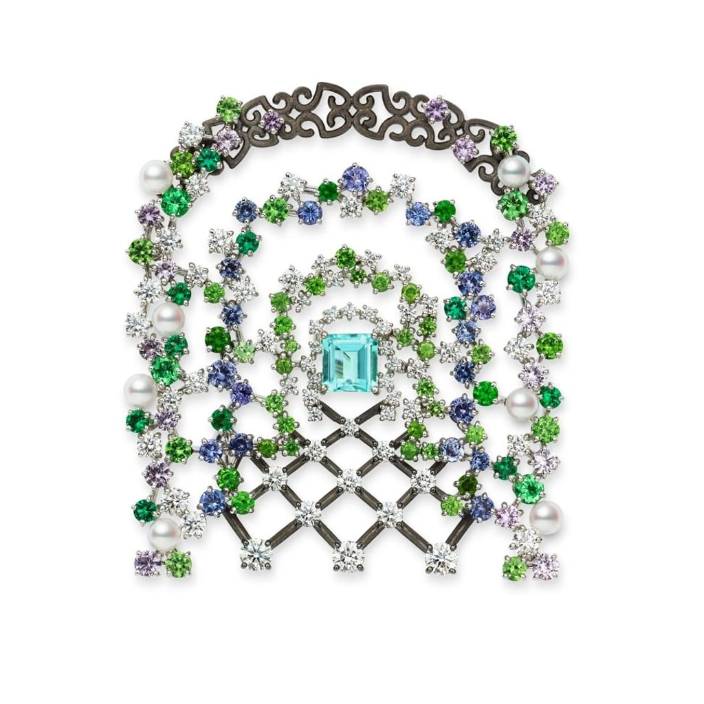 Mikimoto’s gate-shaped brooch, encrusted with Akoya, emerald, tanzanite and sapphire, pays homage to the majestic gardens of a bygone era.