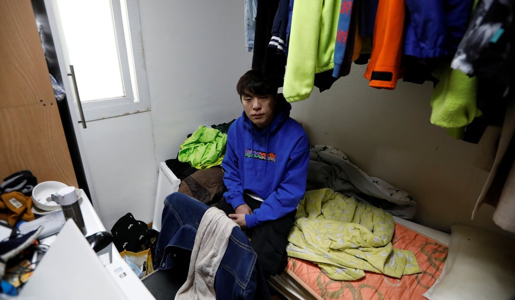 Hwang Hyeon-dong in his 6.6-square-metre cubicle home in Seoul. Photo: Reuters
