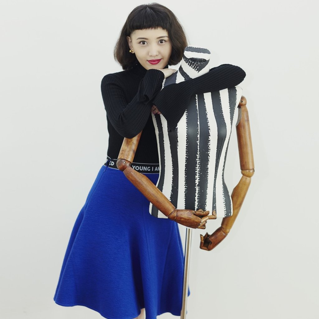 Christine Lau makes flamboyant clothing designed to be worn for parties or special occasions.