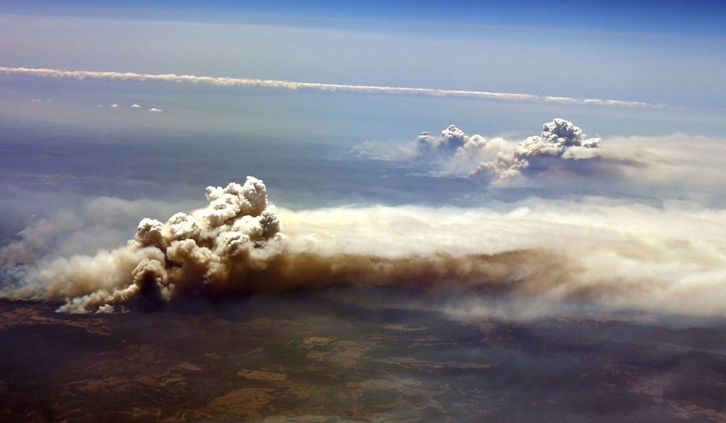 An aerial view of an out-of-control bush fire burning in New South Wales on Tuesday. Photo: AFP