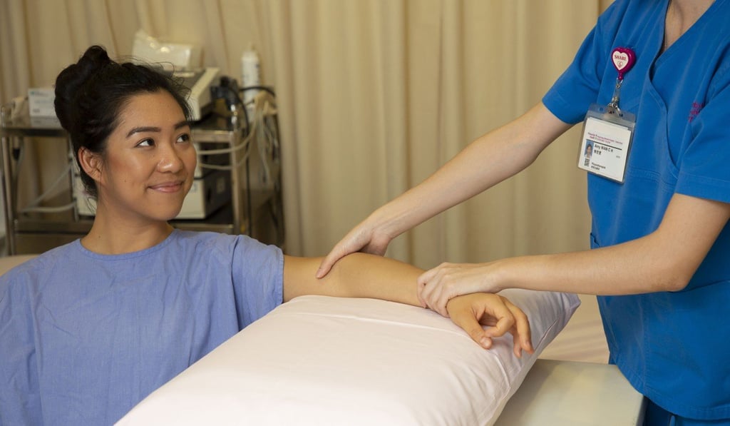 Breast cancer patients also receive guidance about techniques for exercising and massaging themselves to improve flexibility in the joints and drain fluid that builds up in body tissues. Photo: Frank Freeman