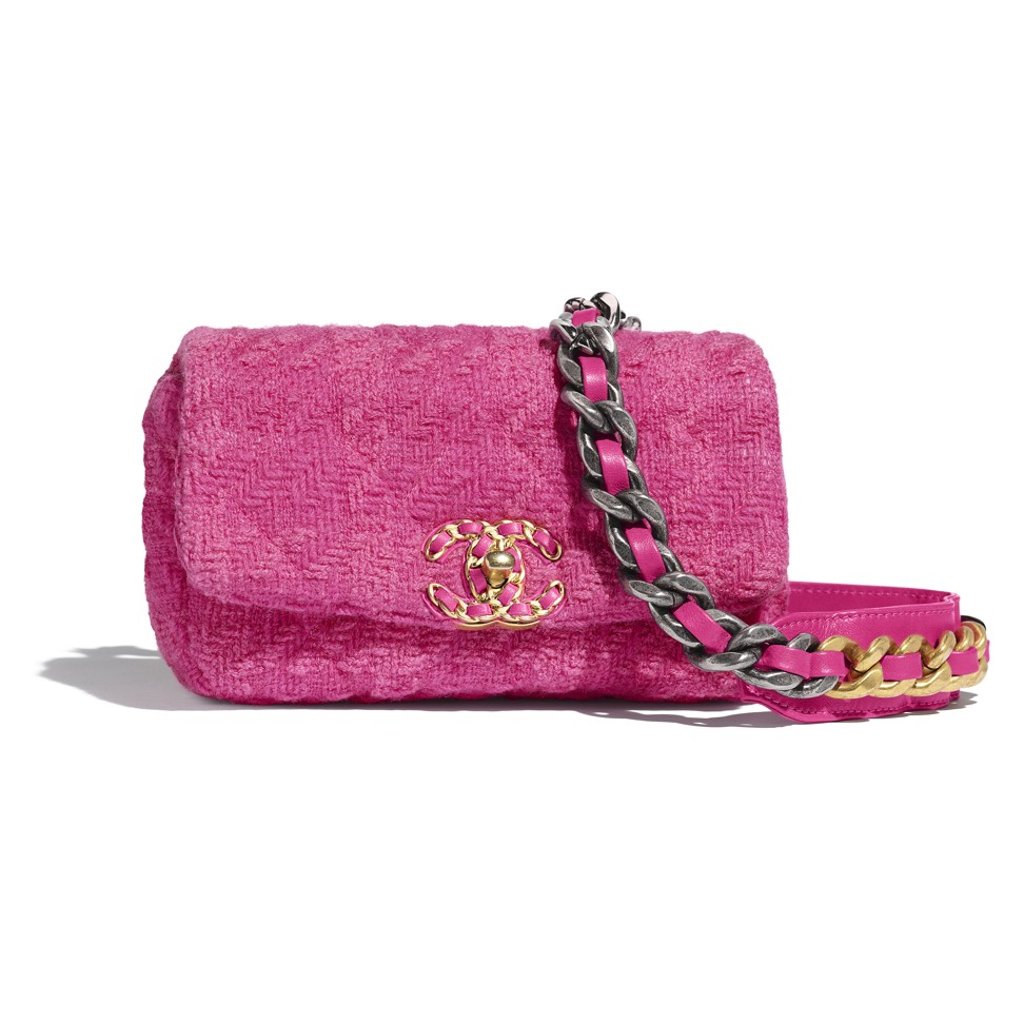 Chanel’s wool tweed waist bag highlights pink, gold and silver tones. Chanel’s wool tweed waist bag highlights pink, gold and silver tones.