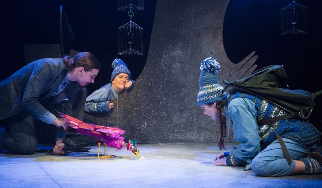 A family of three go in search of a colourful bird in the stage production of Chris Haughton’s 2014 children’s book, Shh! We Have a Plan.