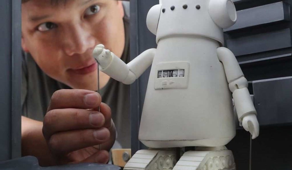 Kid Koala (left) the stage name of DJ, writer and musician Eric San, with his robot creation – the star of his children’s production, DJ Kid Koala’s Nufonia Must Fall.