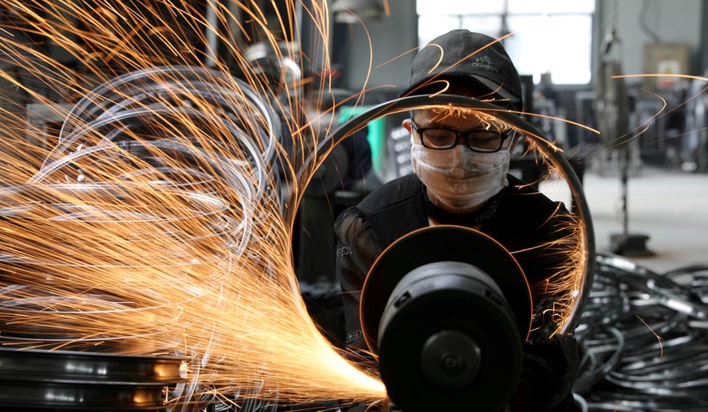 There’s a hole in China’s economic statistics. Pictured, a worker polishes a bicycle steel rim at a factory in Hangzhou. Photo: Reuters