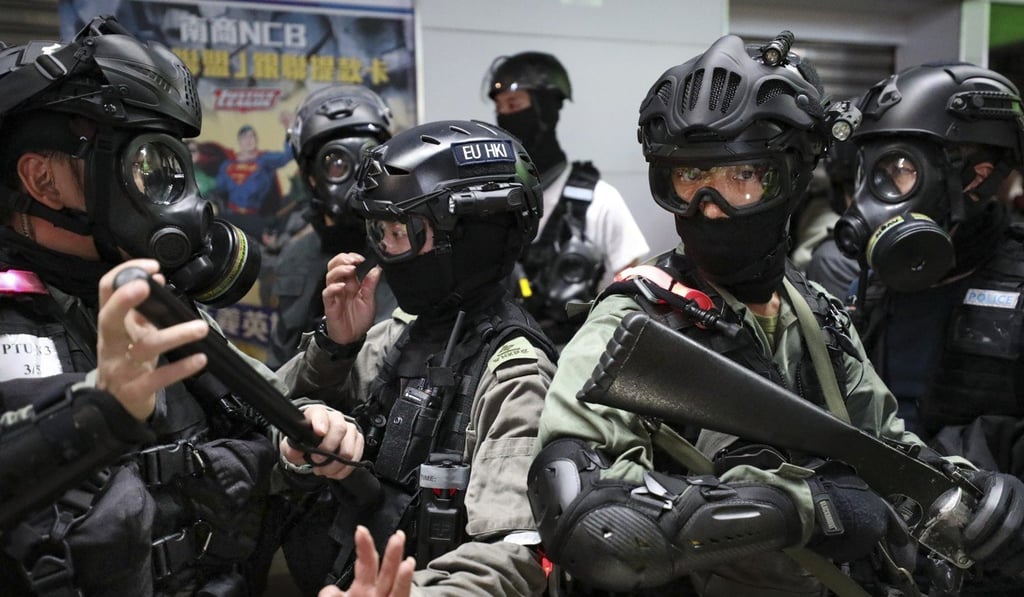 Riot police and members of the Special Tactical Squad, also known as Raptors, in Causeway Bay, on November 11. Photo: James Wendlinger