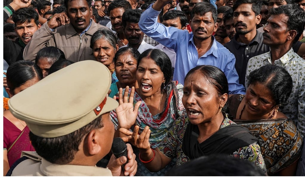Demonstrators argue with a police officer during a protest against the alleged rape and murder of a 27-year-old woman in Hyderabad, India. Photo: Reuters