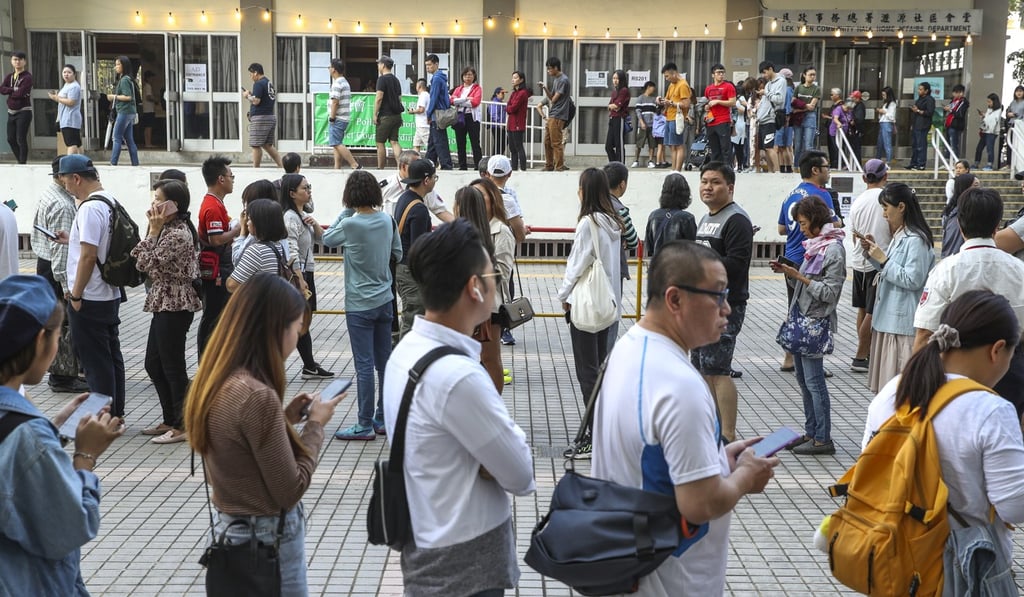 People queue up to cast their ballots at a polling station in Lek Yuen Estate. Photo: Winson Wong
