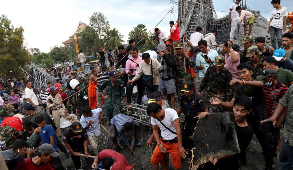 Cambodian rescuers search for victims after a construction accident at a temple in Siem Reap on Monday. Photo: AFP Cambodian rescuers search for victims after a construction accident at a temple in Siem Reap on Monday. Photo: AFP