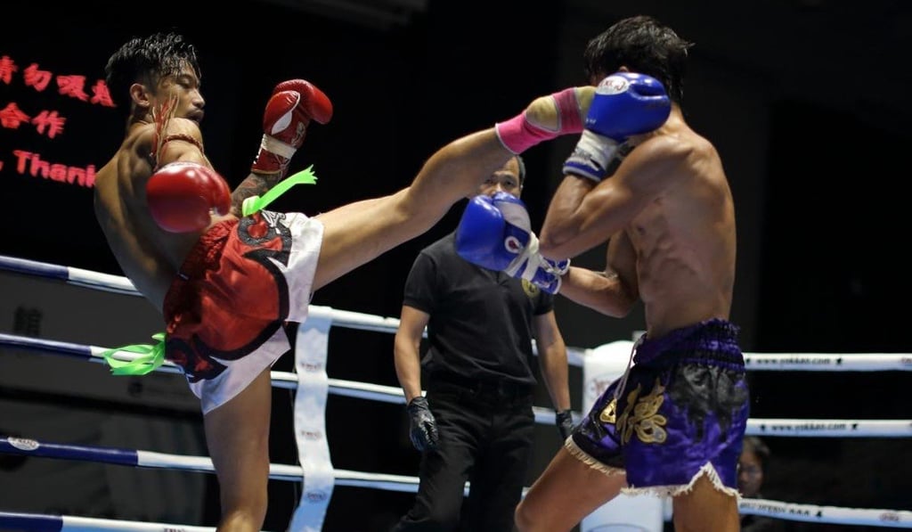 Michael Dacuno lays a clean right high-kick on his opponent at a China event earlier in the year. Photo: Handout Michael Dacuno lays a clean right high-kick on his opponent at a China event earlier in the year. Photo: Handout