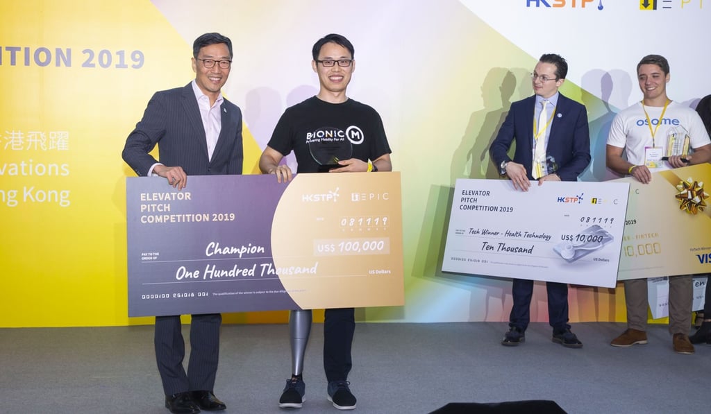 Sun Xiaojun (second left), founder and CEO of overall champion BionicM – which makes hi-tech advanced artificial legs and mobility solutions – with Albert Wong (far left), CEO of Hong Kong Science and Technology Parks Corp, which organised the event, and other category winners. Photo: Frank Freeman