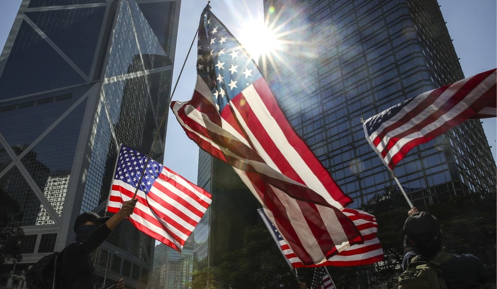 Anti-government protesters wave American flags at a rally in Central on December 1 to thank the US government for passing the Hong Kong Human Rights and Democracy Act. Photo: Winson Wong