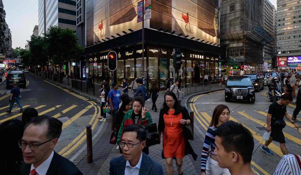 Office goers in Tsim Sha Tsui district of Hong Kong. Photo: AFP