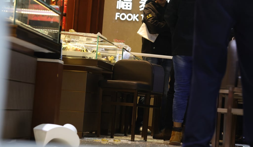 The suspects used a sledgehammer to break open glass cabinets at the shop in Sham Shui Po. Photo: May Tse