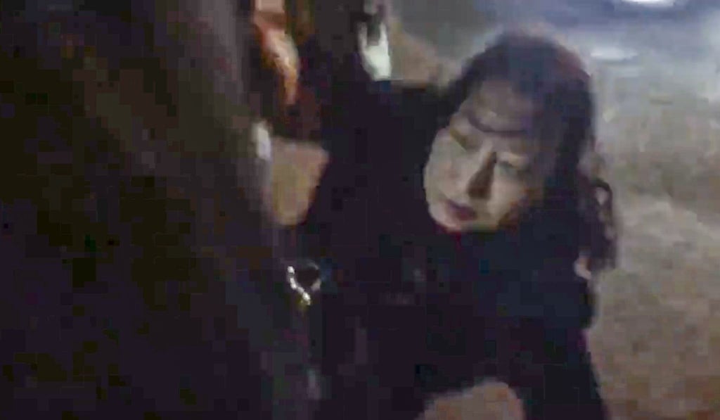 Secretary for Justice Teresa Cheng falls to the ground after she was surrounded by pro-democracy protesters in London on November 14. Photo: Handout Secretary for Justice Teresa Cheng falls to the ground after she was surrounded by pro-democracy protesters in London on November 14. Photo: Handout