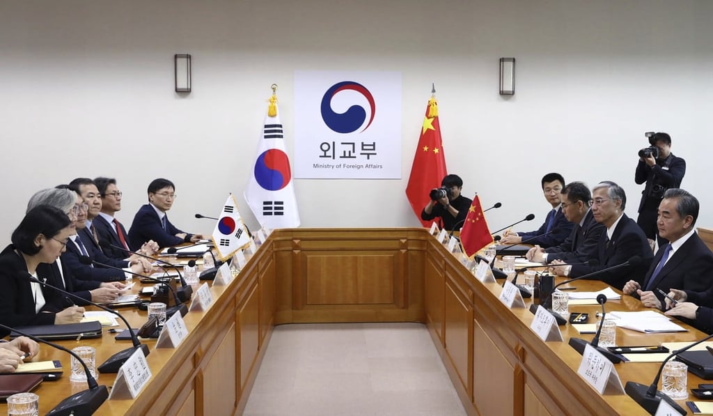 Kang Kyung-wha (second from left) stressed the importance of shared understanding to improve cooperation during the meeting with Wang Yi (right). Photo: AP