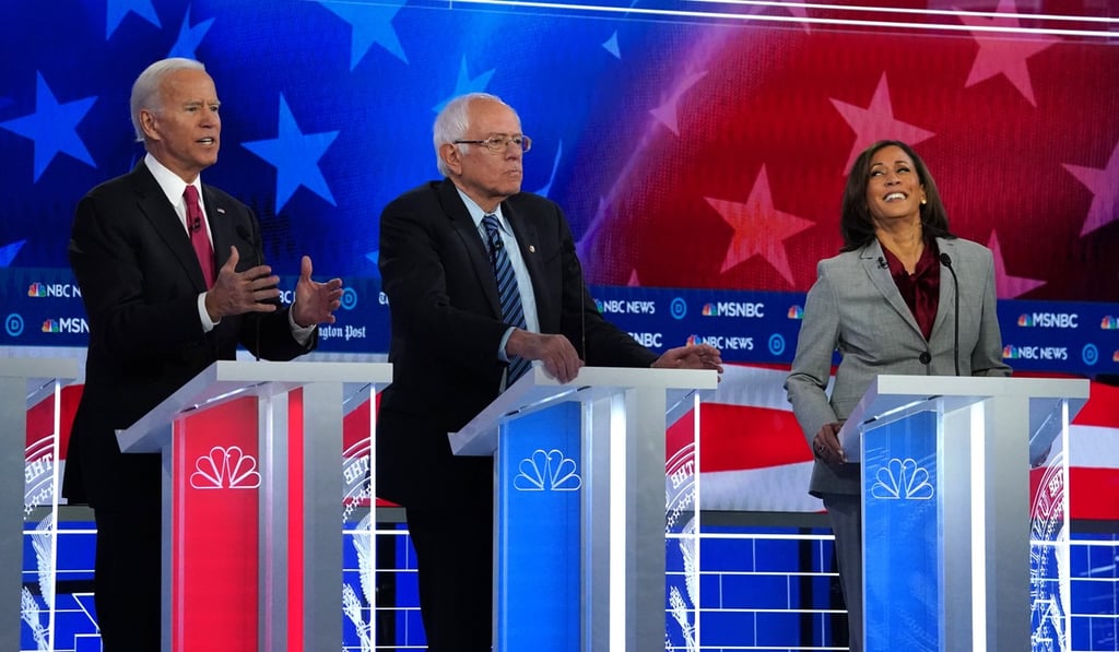 Democratic presidential candidate Joe Biden (left) speaks as Senator Bernie Sanders and Senator Kamala Harris listen during the fifth 2020 campaign debate in Atlanta, Georgia, in November. Photo: Reuters
