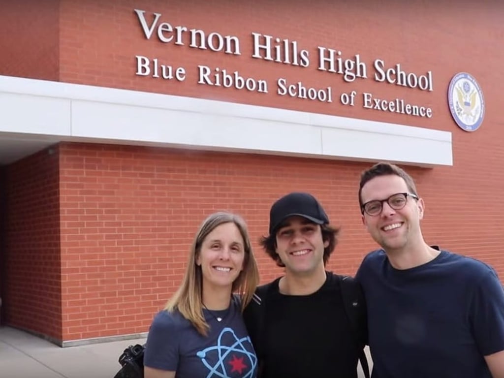 David Dobrik, centre, in front of Vernon Hills High School. Photo: Jason Nash/YouTube