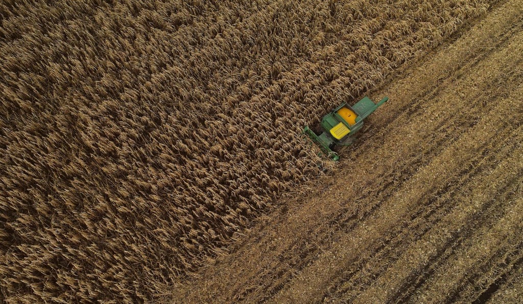 A combine harvester pushes through a field of corn in Warsaw, New York state, in November. The US is pushing China to agree to buy more agricultural produce. Photo: AP A combine harvester pushes through a field of corn in Warsaw, New York state, in November. The US is pushing China to agree to buy more agricultural produce. Photo: AP