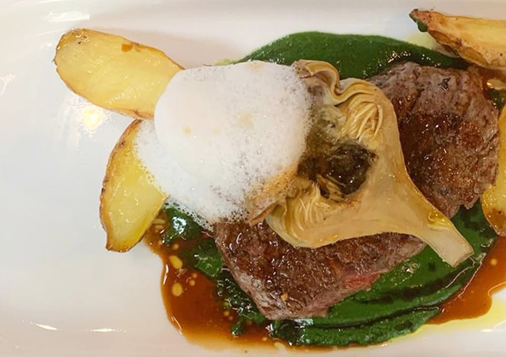 Pan-seared Australian wagyu M5 beef tenderloin, spinach coulis, Roman artichoke, roasted potatoes and truffle foam at Crit Room.