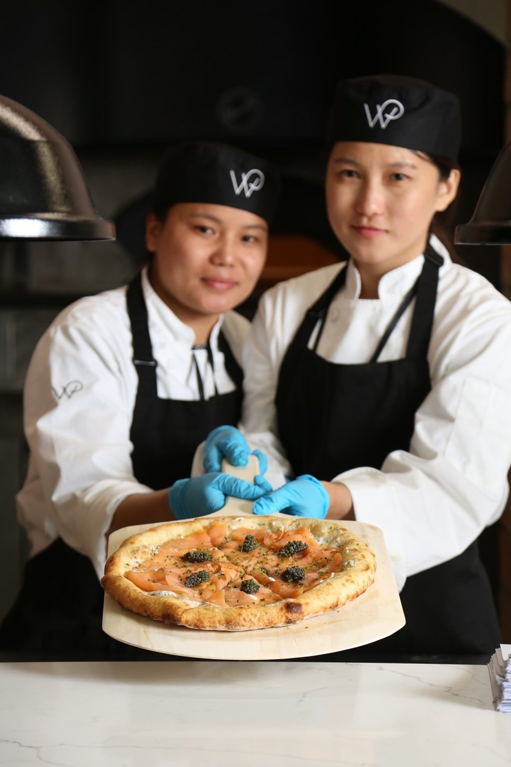 Wolfgang Puck Kitchen’s salmon pizza with caviar is ideal for an Instagram post.