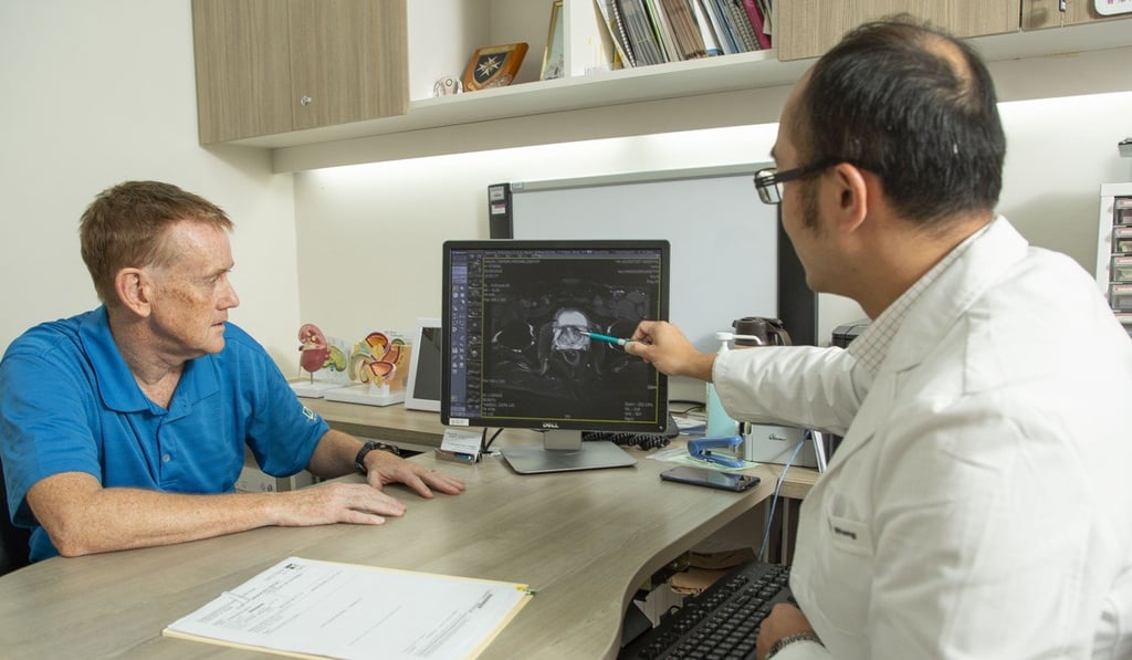 Prostate cancer patient Damian Walsh (left) discusses his progress with urologist, Dr Edmond Wong Ming-ho, at Hong Kong Adventist Hospital – Stubbs Road. Photo: Frank Freeman Prostate cancer patient Damian Walsh (left) discusses his progress with urologist, Dr Edmond Wong Ming-ho, at Hong Kong Adventist Hospital – Stubbs Road. Photo: Frank Freeman