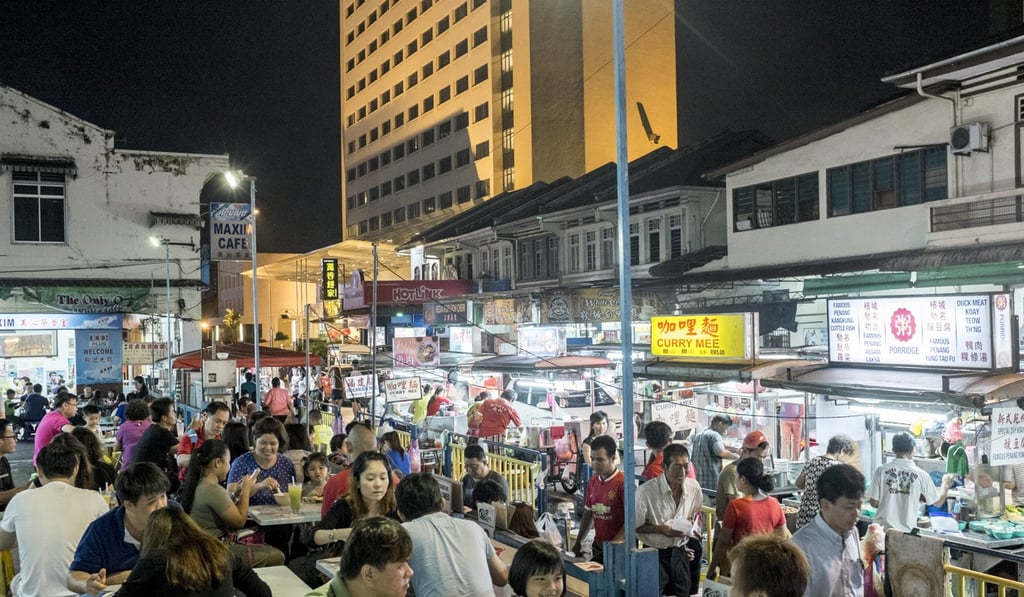 Customers and street food vendors line the streets on Lorong Baru in Penang. Photo: SCMP Pictures