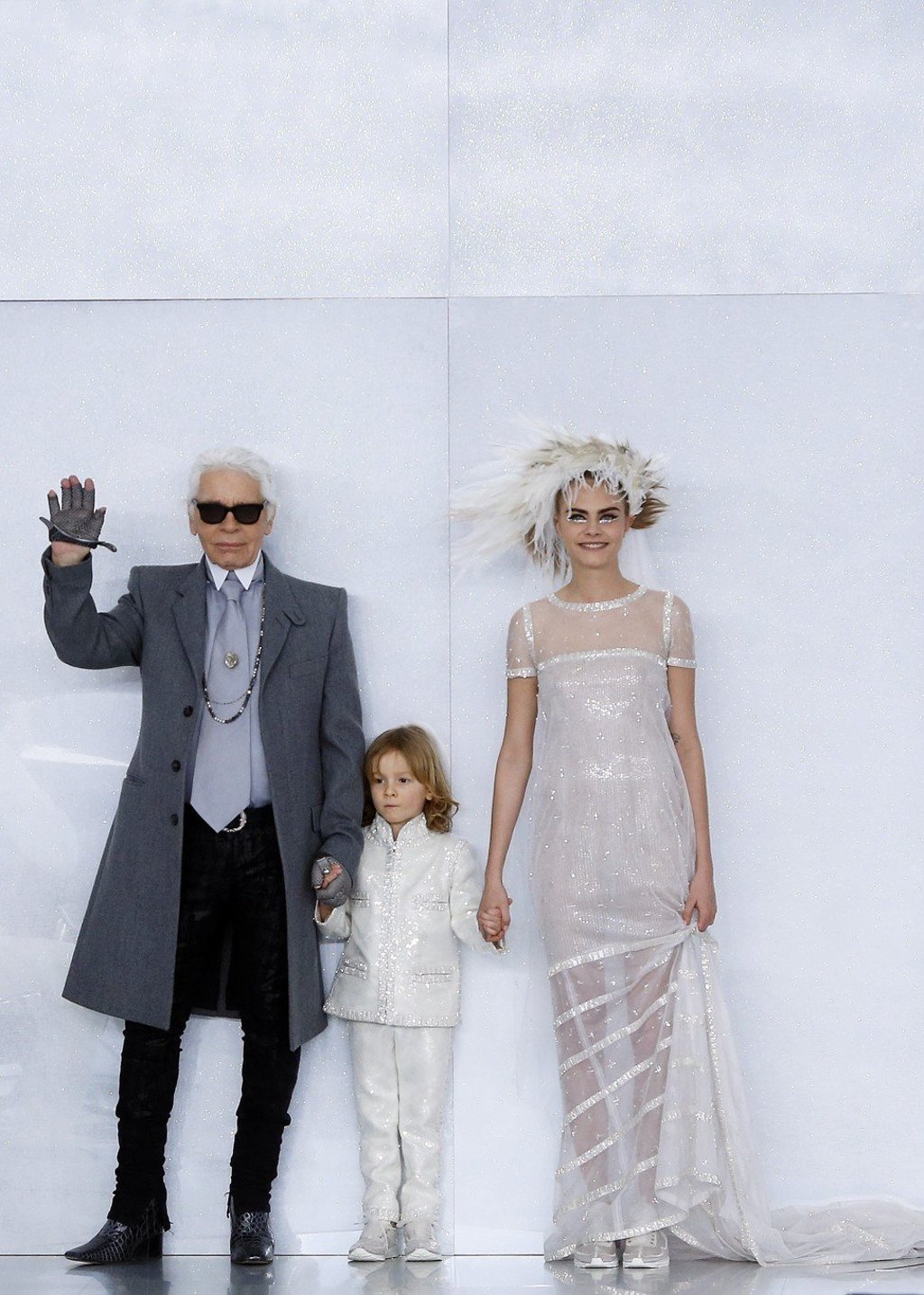 Delevingne was the late Karl Lagerfeld’s muse for a long time. Here, she wears a wedding gown at Chanel’s spring/summer 2014 haute couture fashion show in Paris, with the designer and his godson, Hudson Kroenig. Photo: AP