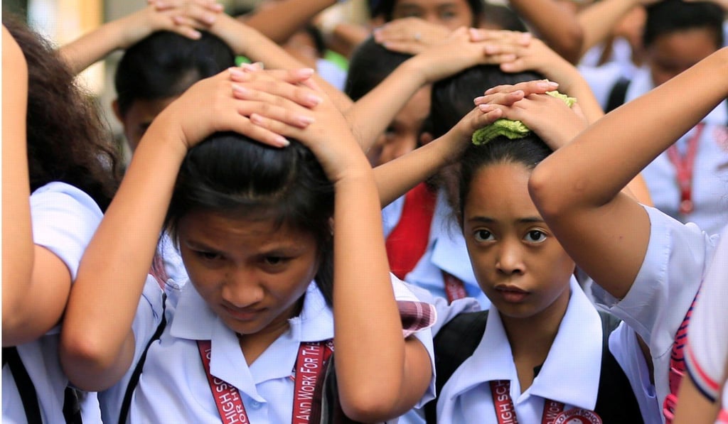Students evacuate their school after an earthquake in Luzon. Photo: Reuters