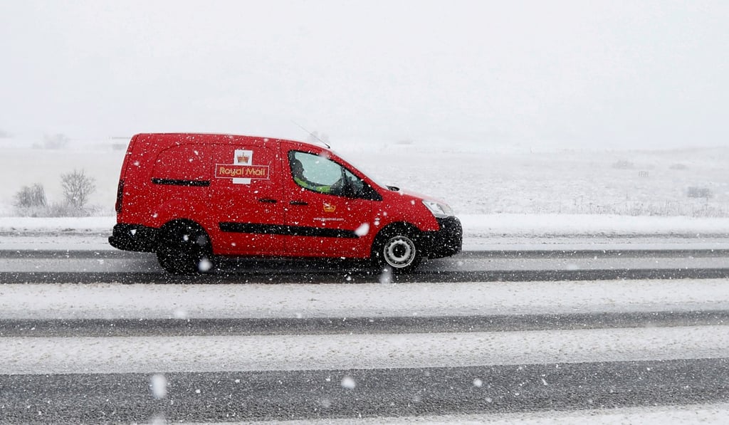 A Royal Mail van drives through the Drumochter Pass in Scotland on March 11. In October, 100,000 Royal Mail staff voted to go on strike over job security and terms, but in November the postal service won a court injunction that will prevent the action. Photo: Reuters