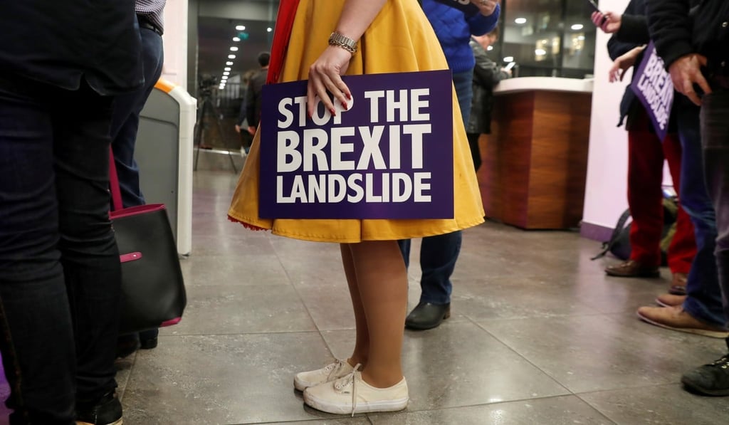 An audience member holds a placard as she attends a “Stop the Brexit landslide” rally in London on Friday. Photo: Reuters An audience member holds a placard as she attends a “Stop the Brexit landslide” rally in London on Friday. Photo: Reuters