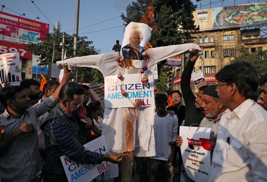 Activists burn an effigy of Narendra Modi during a protest against the Citizenship Amendment Bill in Kolkata on Thursday. Photo: Reuters Activists burn an effigy of Narendra Modi during a protest against the Citizenship Amendment Bill in Kolkata on Thursday. Photo: Reuters