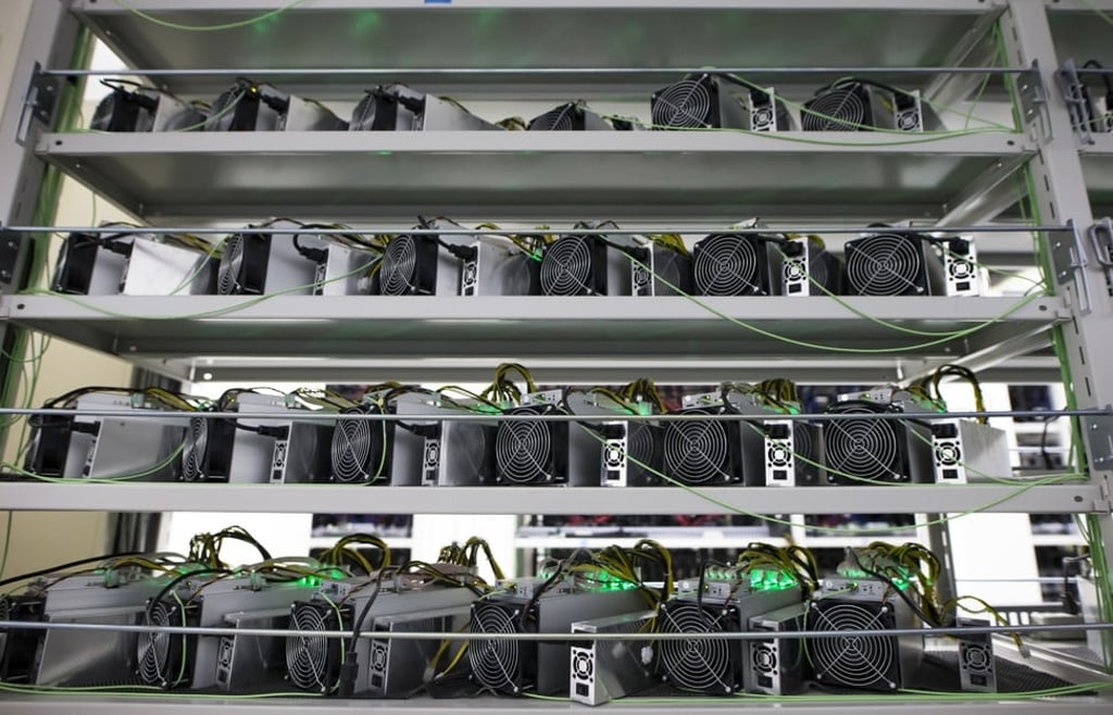 Cryptocurrency mining rigs from Bitmain Technologies sit on a shelf inside the DMM Mining Farm in Kanazawa, Japan, on March 20, 2018. Photo: Bloomberg Cryptocurrency mining rigs from Bitmain Technologies sit on a shelf inside the DMM Mining Farm in Kanazawa, Japan, on March 20, 2018. Photo: Bloomberg