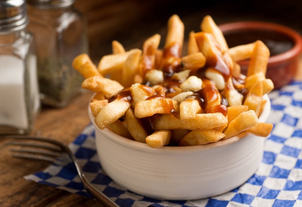 Classic French Canadian poutine, served with French fries, gravy and cheese curds.