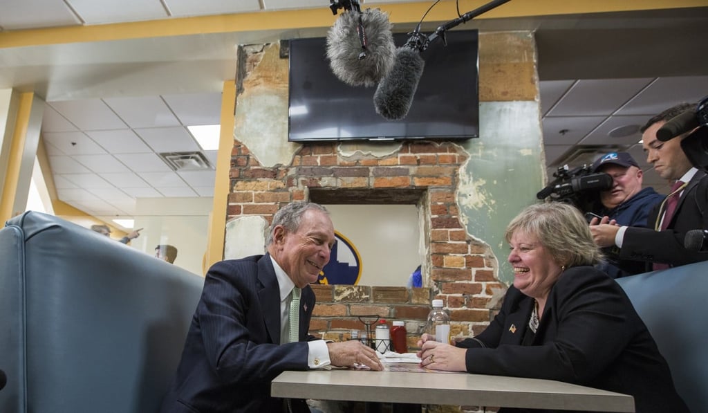 Michael Bloomberg speaks with Virginia delegate-elect Nancy Guy during a campaign stop. Photo: AP
