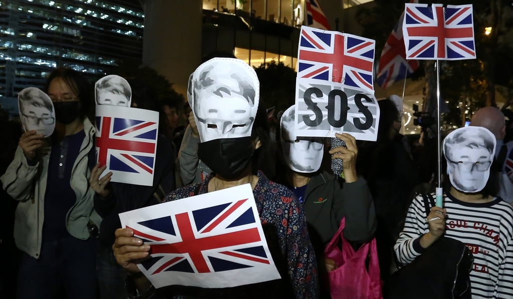 Protesters wave the Union flag outside the British Consulate in Admiralty on November 29 in support of Simon Cheng, a British Consulate employee who was detained on the mainland. Photo: Jonathan Wong